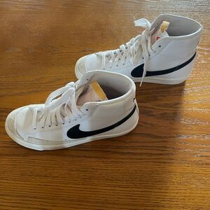Nike White High-Top Sneakers with Black Swoosh